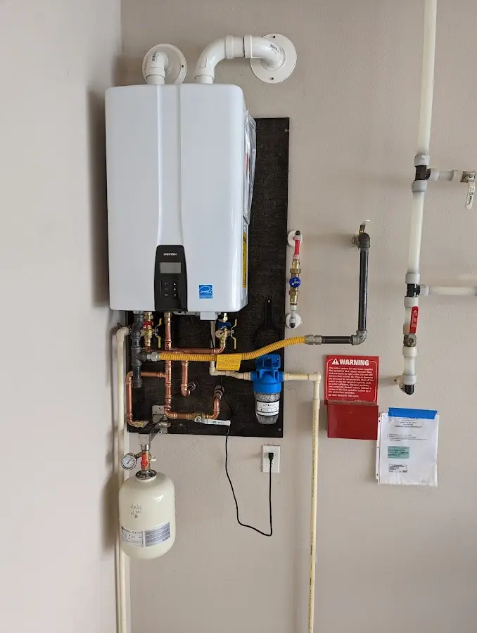 Professional plumber installing copper piping in a Allen Park home